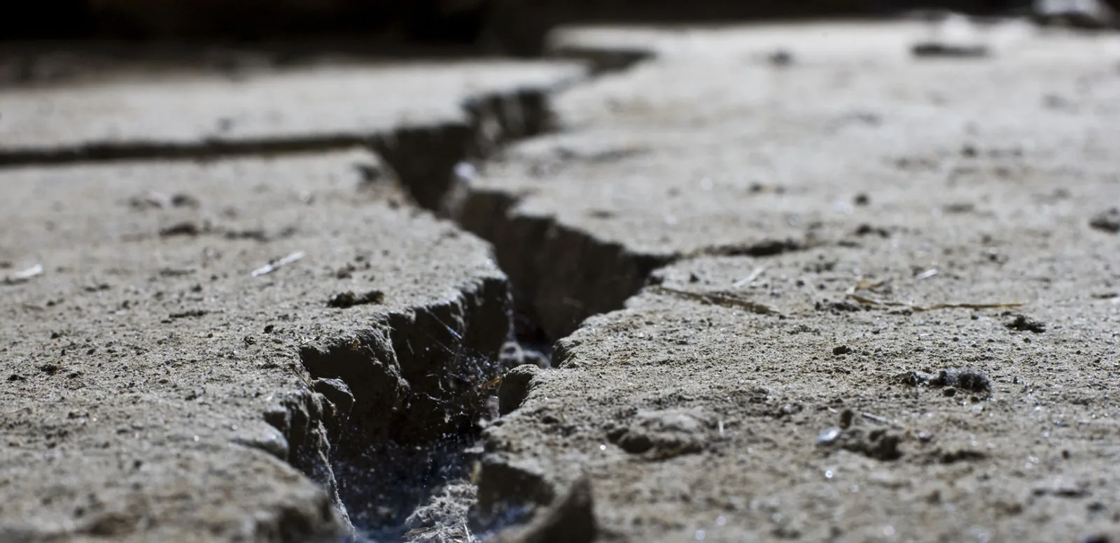 Cracked, sinking concrete driveway before repair